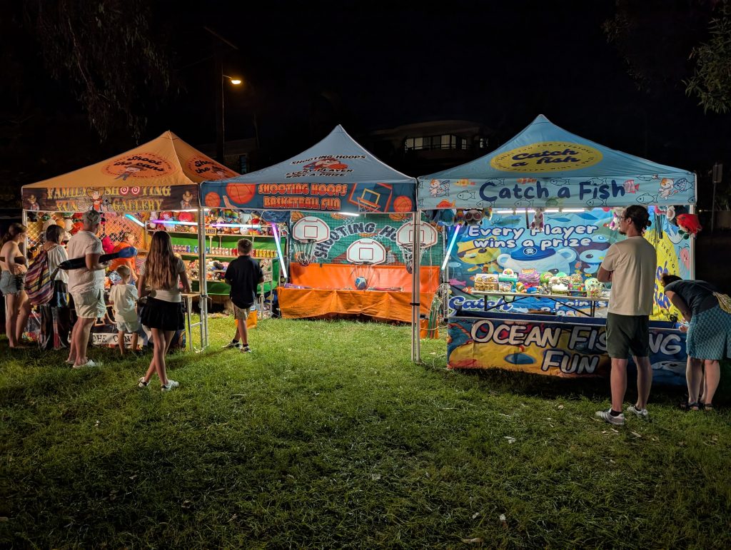 side show alley set up night